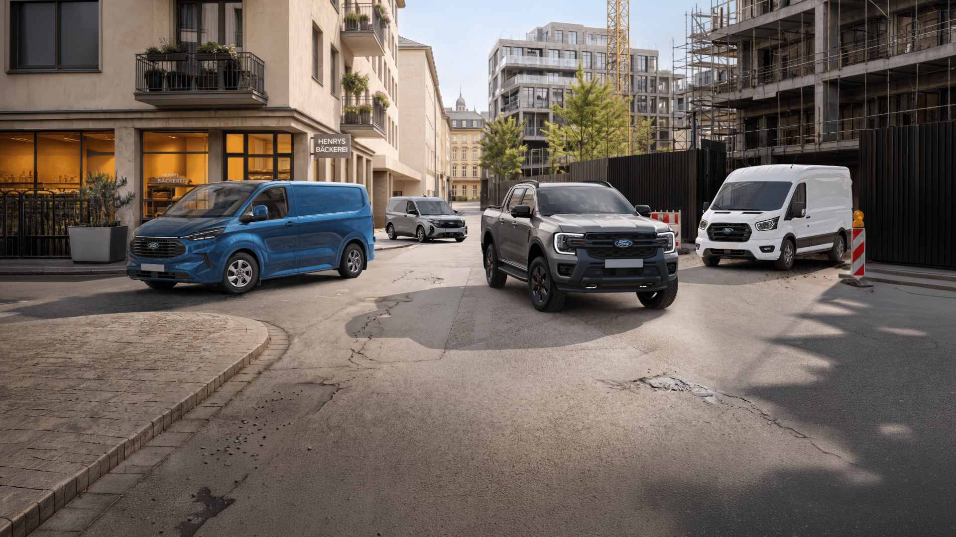 Gama vehículos comerciales Ford aparcados en la calle 
