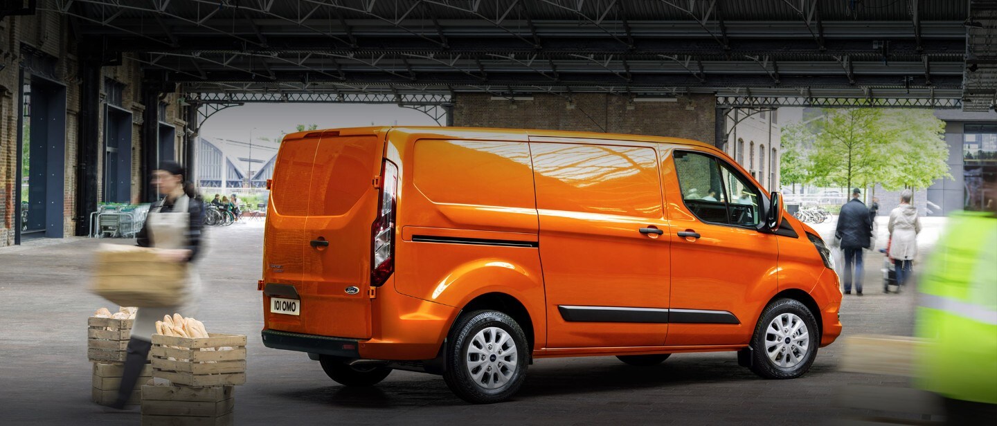 New Orange Ford Transit Custom in bakery warehouse