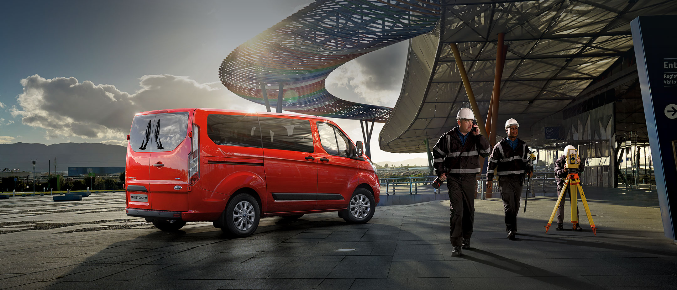 Orange Ford Transit Custom at construction site Orange Ford Transit Custom at construction site