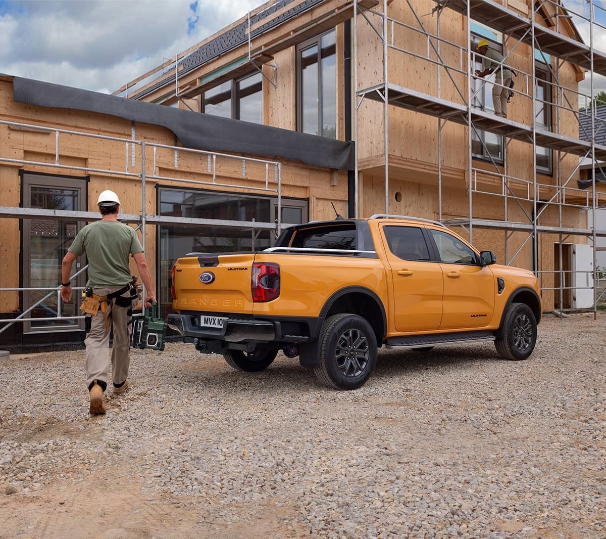 All-New Ford Ranger parked by construction 3/4 rear view