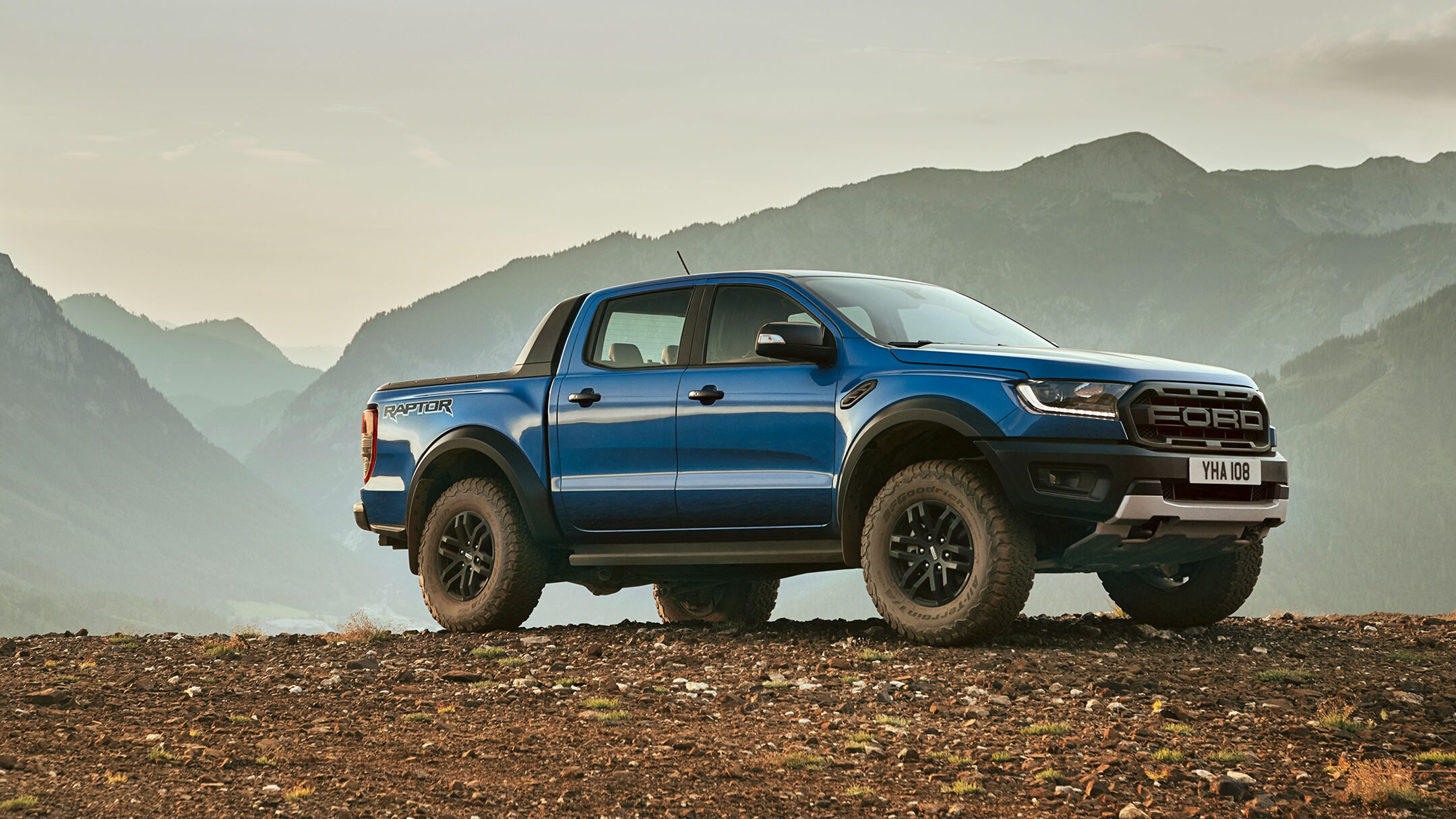 Ford Ranger Raptor parked in the middle of mountains Ford Ranger Raptor parked in the middle of mountains