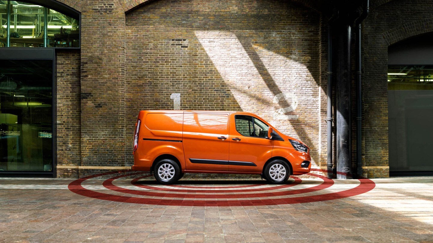 New Ford Transit Custom parked against brick building